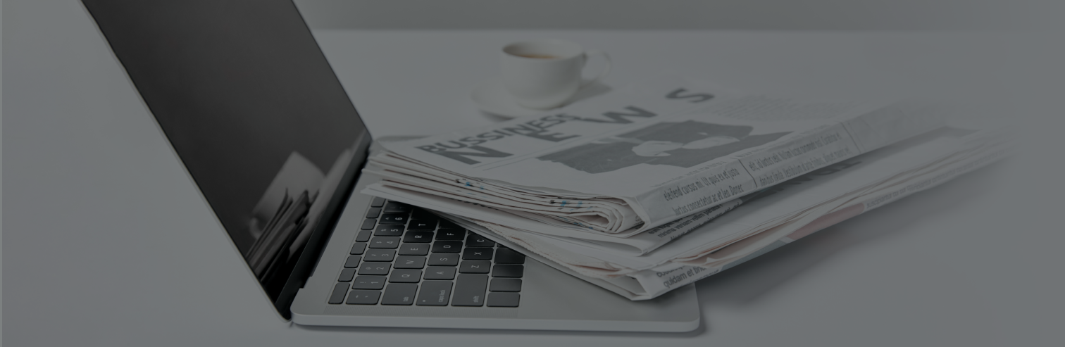 laptop newspaper