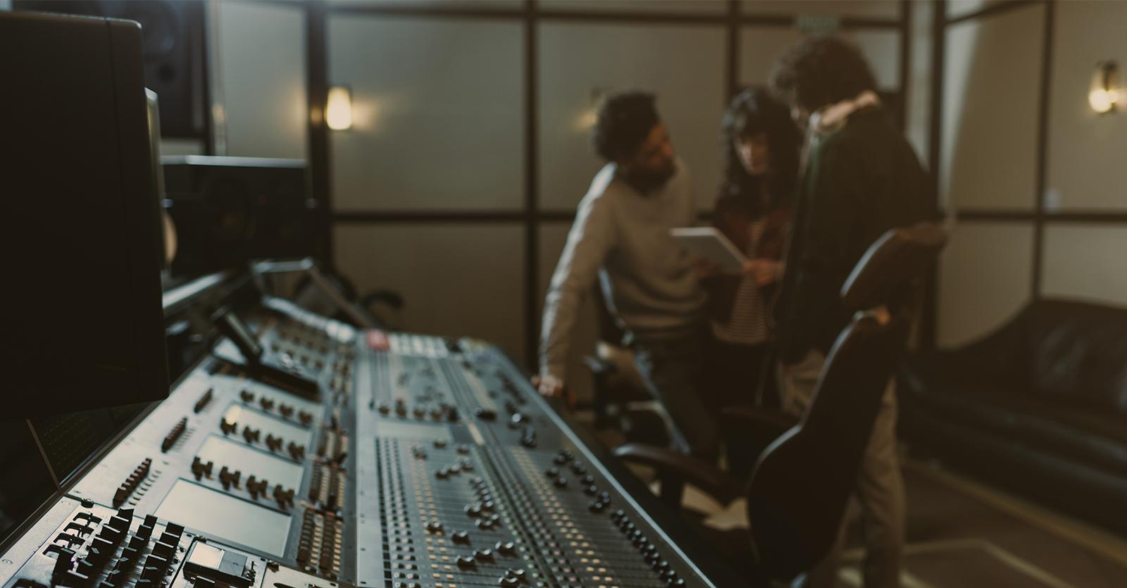 people gathering near sound board